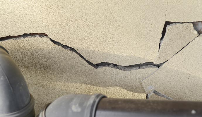 plaster wall with crack building additional problem